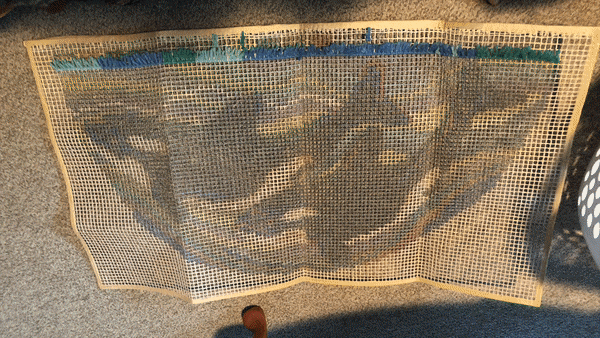 GIF of orca rug being made row by row